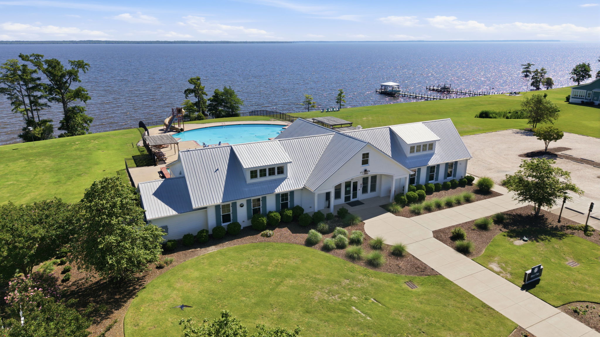 Aerial view of the Occano clubhouse, pool, and dock on the Albemarle Sound
